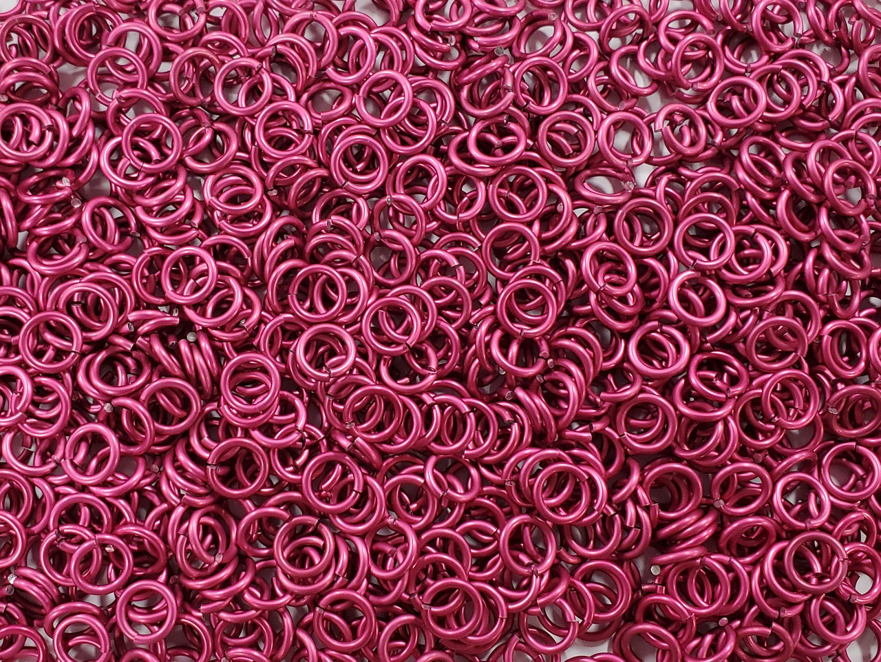 Cosmic Pink Anodized Aluminum jump rings in 14 SWG, 5/16 inch ID, 1/2 lb (8 oz)