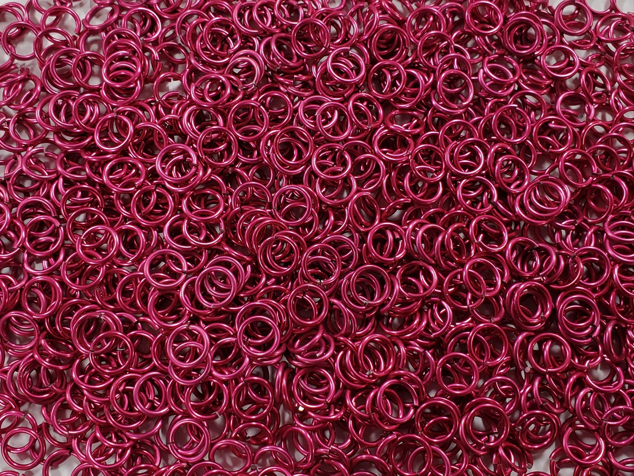 Cosmic Pink Anodized Aluminum jump rings in 16 SWG, 5/16 inch ID, 1/2 lb (8 oz)