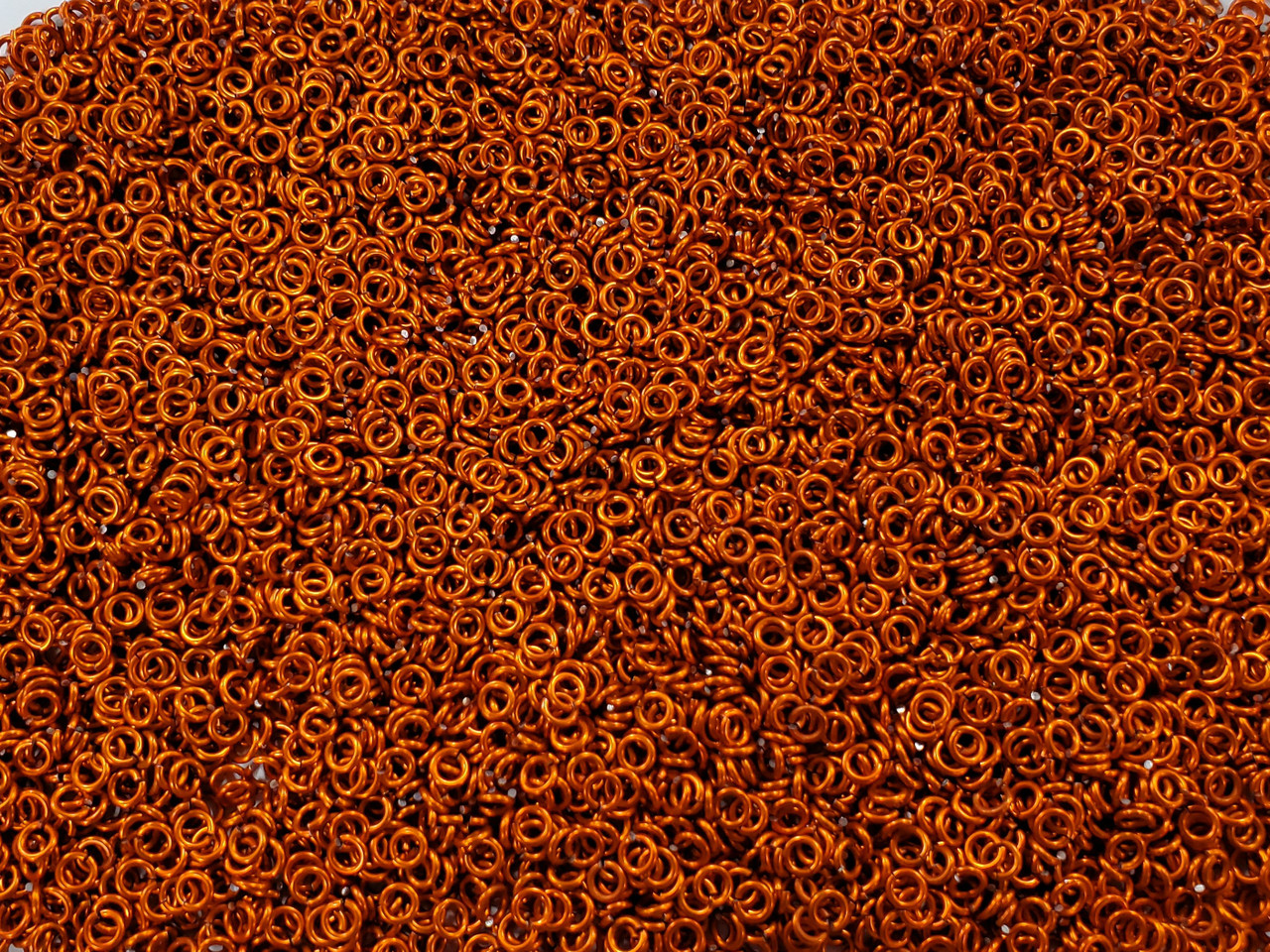 Orange Anodized Aluminum jump rings in 18 SWG, 1/8 inch ID, 1/4 lb (4 oz)
