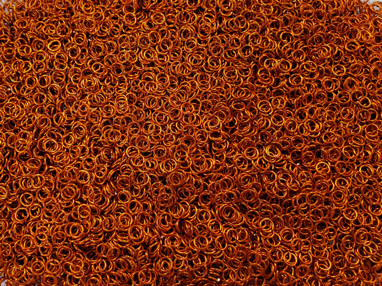 Orange Anodized Aluminum jump rings in 20 SWG, 3/16 inch ID, 1/4 lb (4 oz)