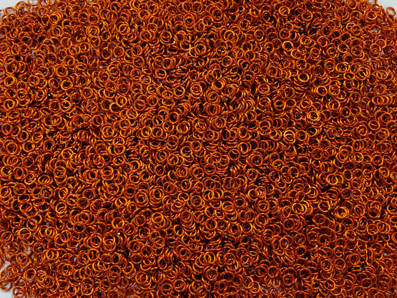 Orange Anodized Aluminum jump rings in 20 SWG, 9/64 inch ID, 1/4 lb (4 oz)