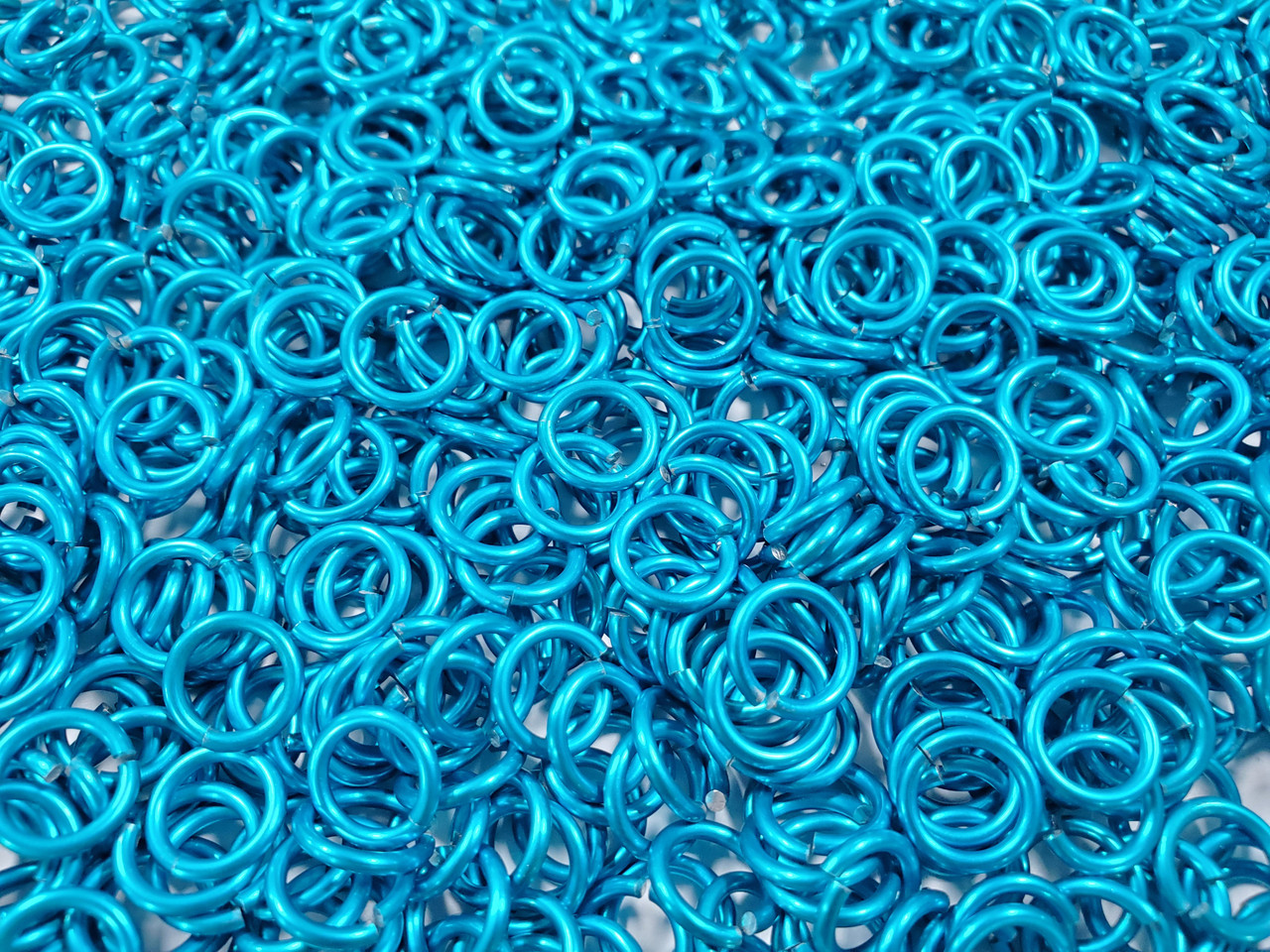 Turquoise Anodized Aluminum jump rings in 16 SWG, 9/32 inch ID, 1/2 lb (8 oz)