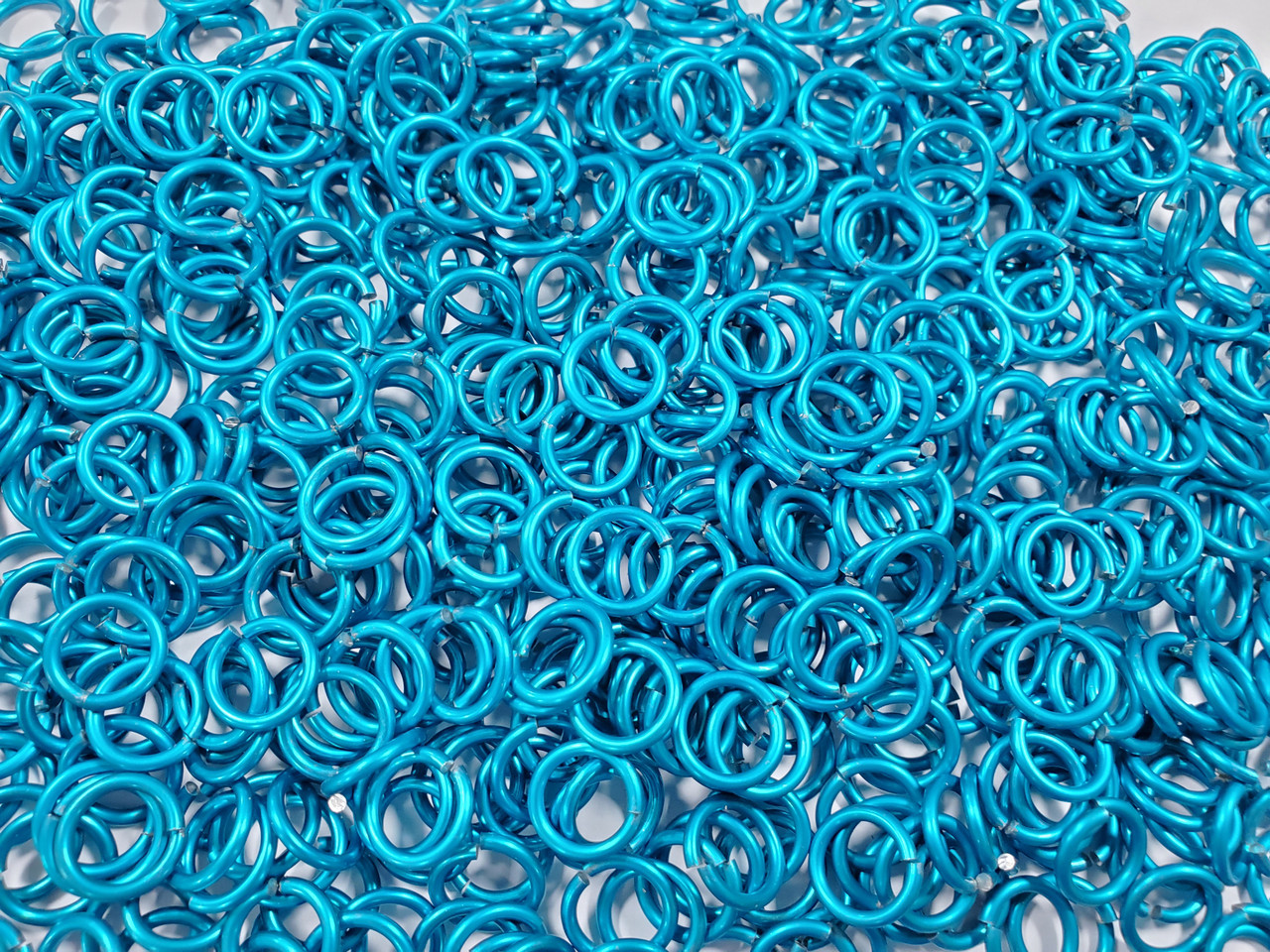 Turquoise Anodized Aluminum jump rings in 14 SWG, 3/8 inch ID, 1/2 lb (8 oz)