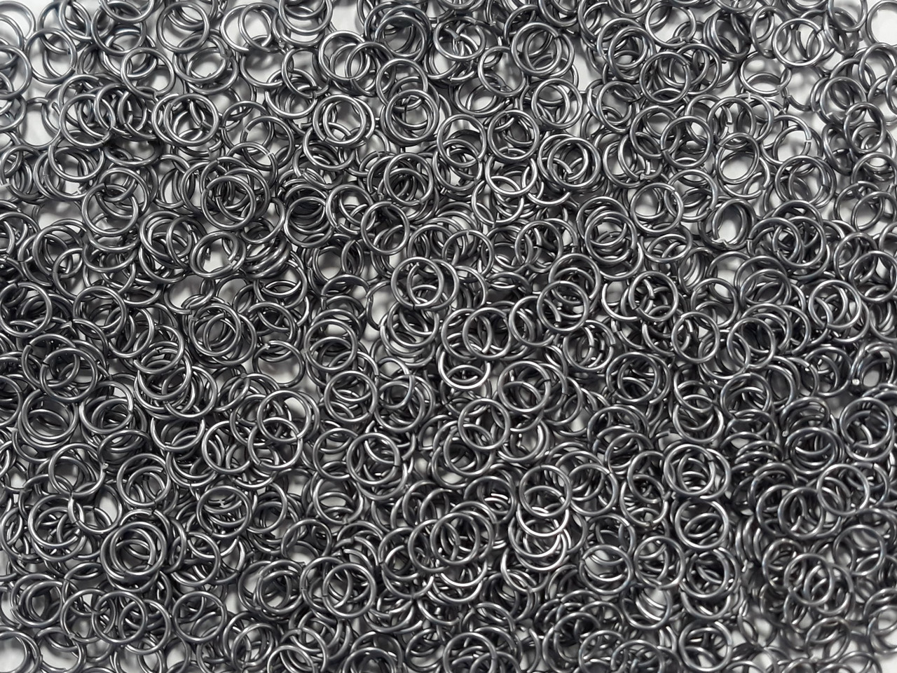 Stormy Gray Anodized Aluminum jump rings in 18 SWG, 9/32 inch ID, 1/2 lb (8 oz)