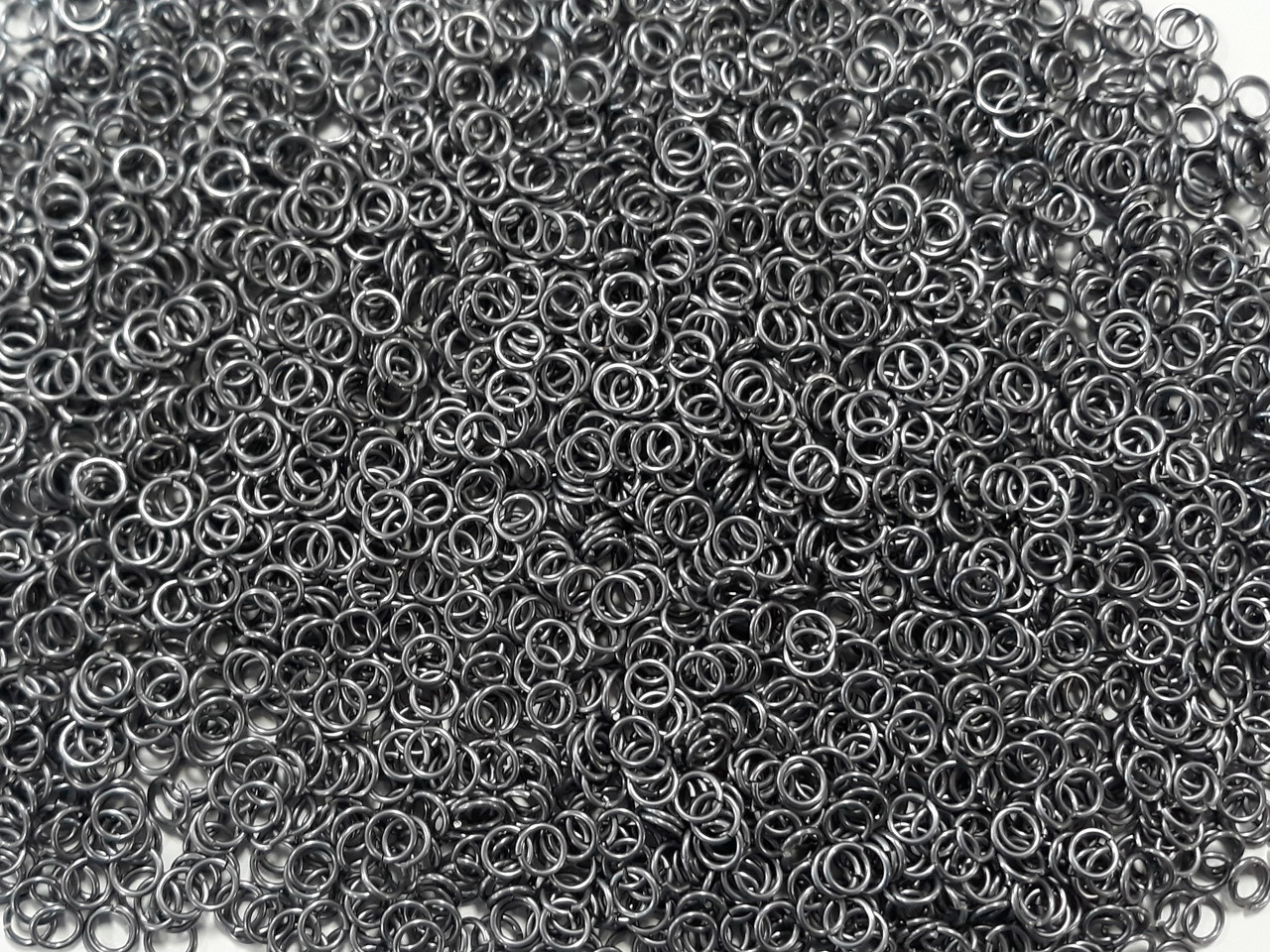 Stormy Gray Anodized Aluminum jump rings in 18 SWG, 7/32 inch ID, 1/2 lb (8 oz)