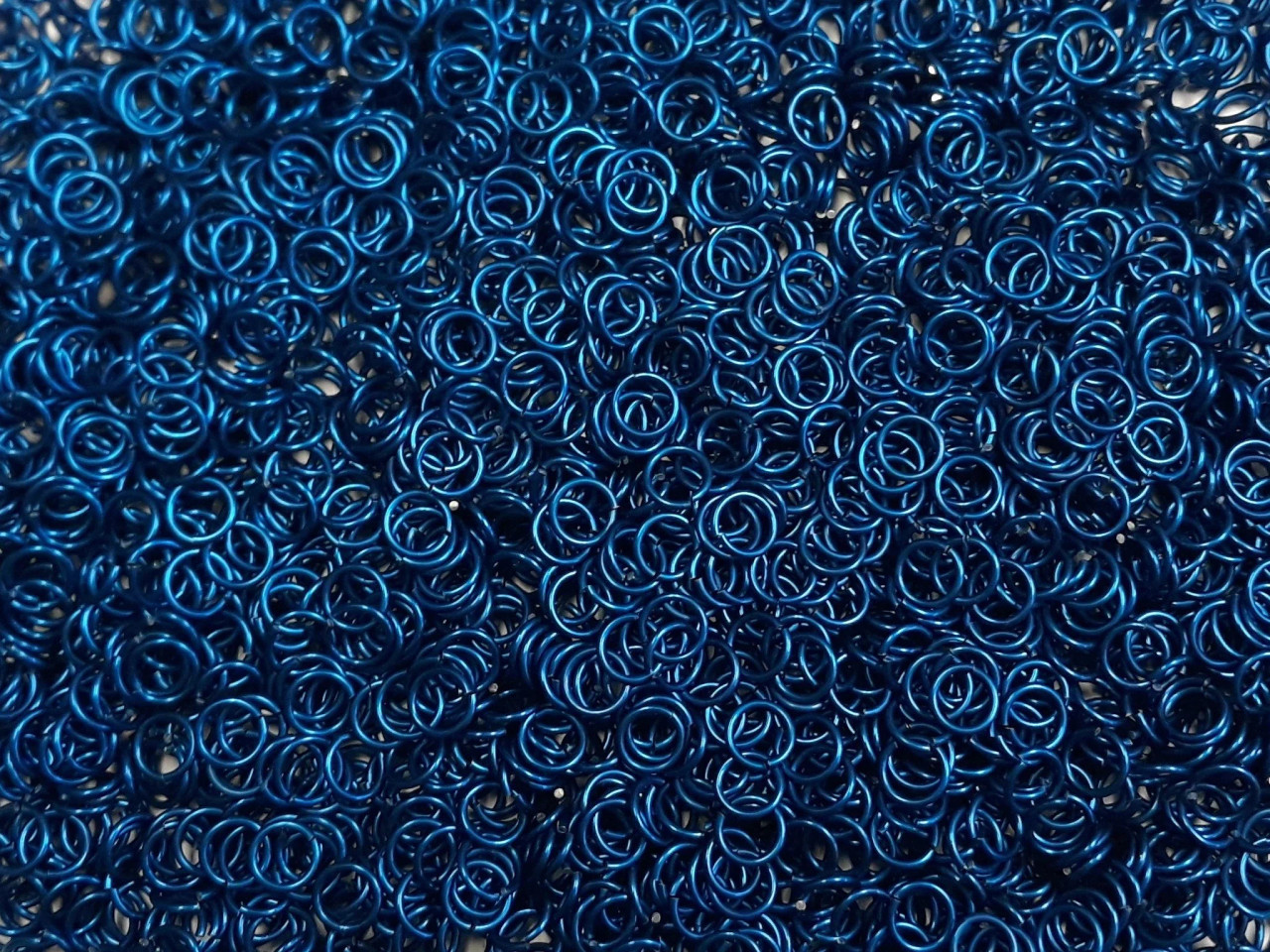 Blue Anodized Aluminum jump rings in 18 SWG, 1/4 inch ID, 1/2 lb (8 oz)