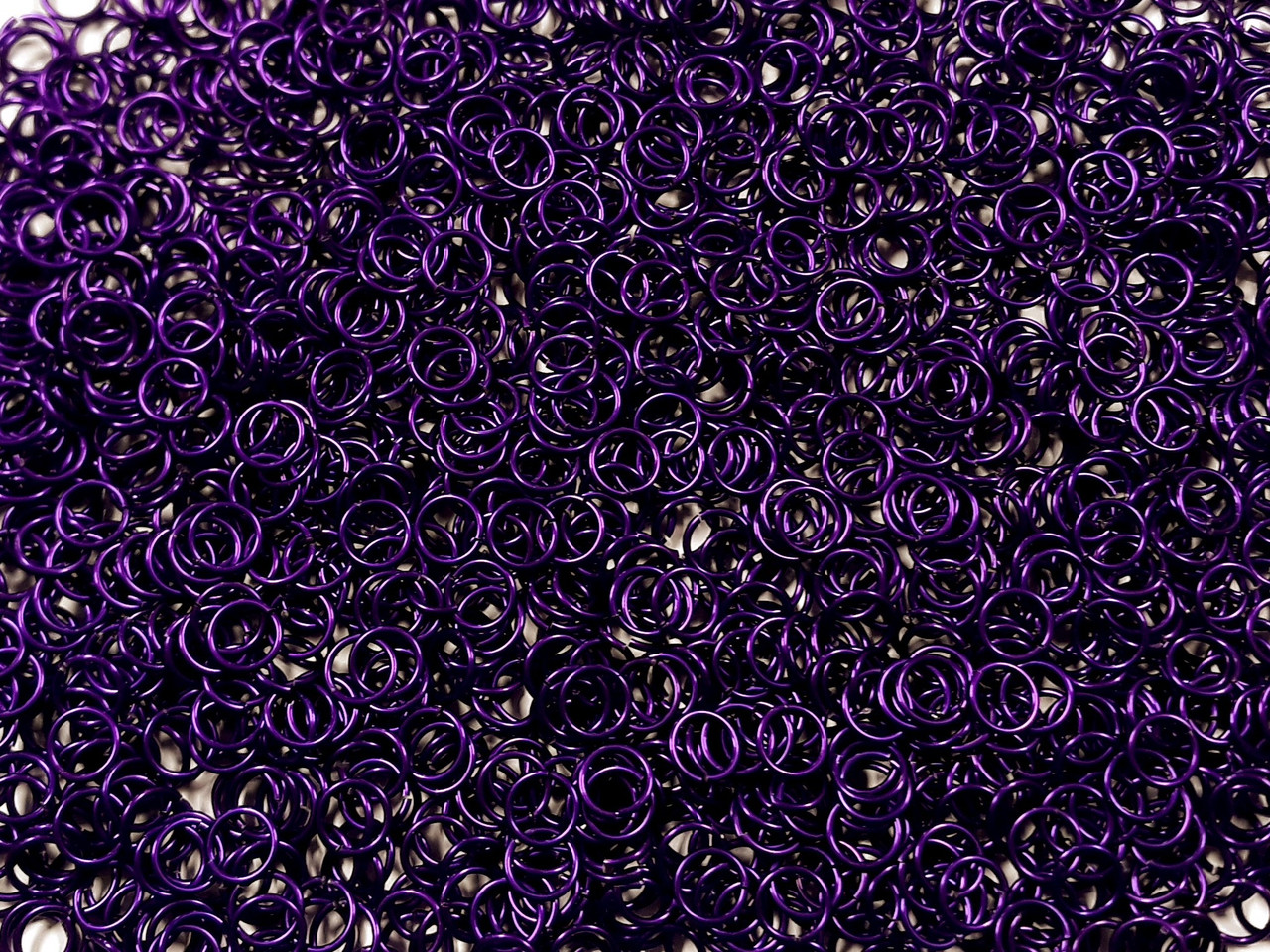 Violet Anodized Aluminum jump rings in 18 SWG, 9/32 inch ID, 1/2 lb (8 oz)