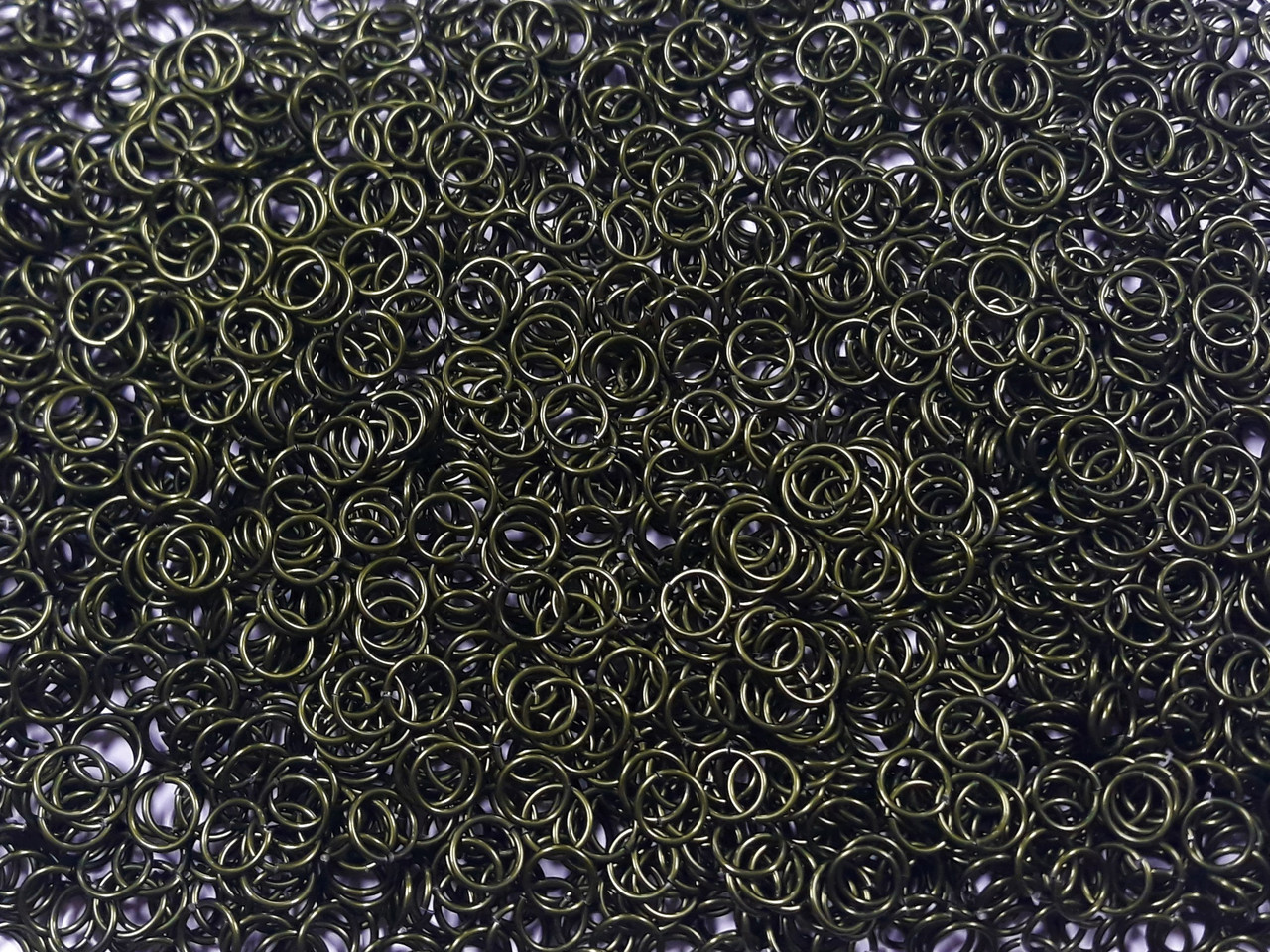 OD Green Anodized Aluminum jump rings in 18 SWG, 9/32 inch ID, 1/2 lb (8 oz)