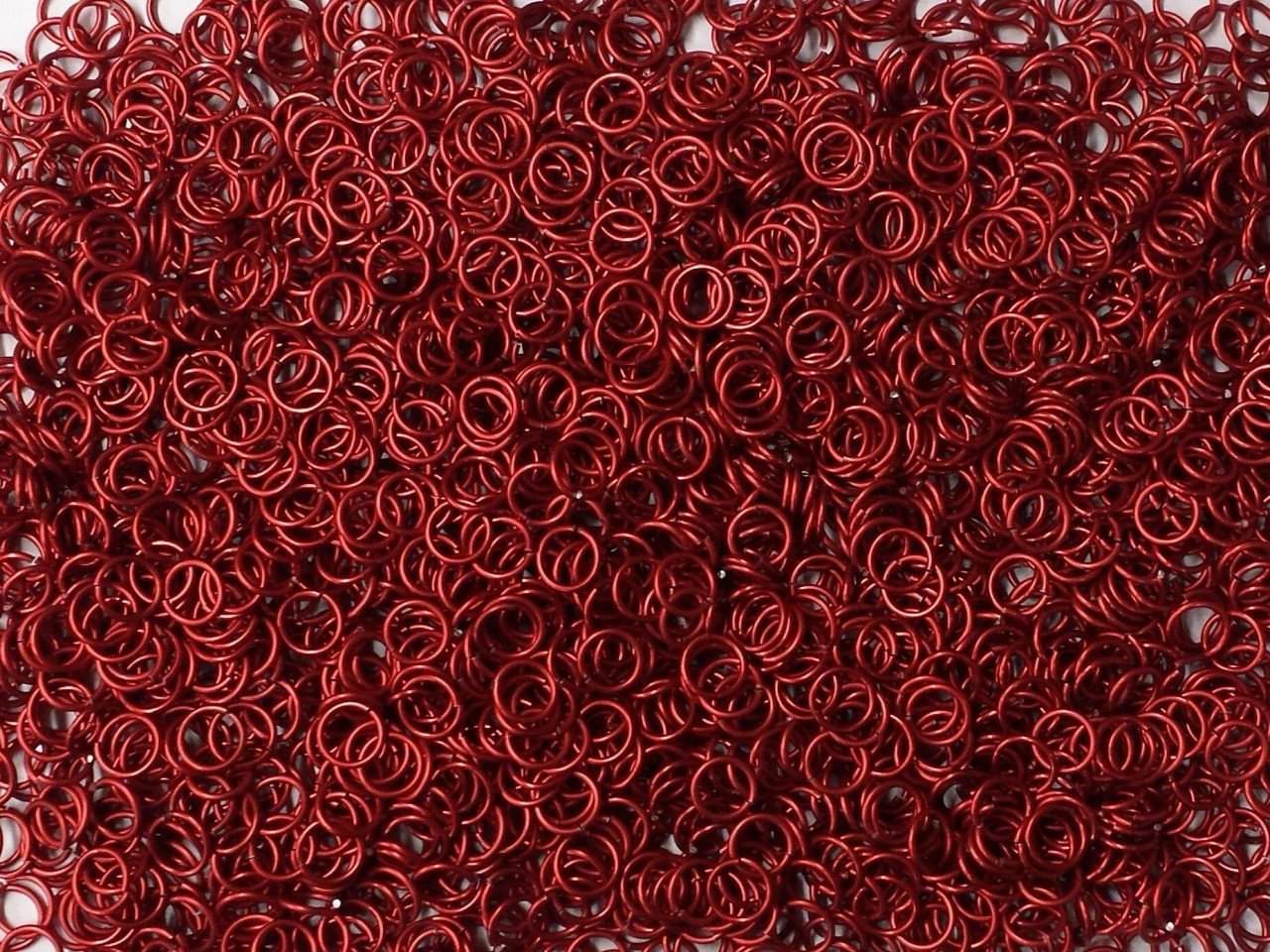 Red Anodized Aluminum jump rings in 18 SWG, 9/32 inch ID, 1/2 lb (8 oz)