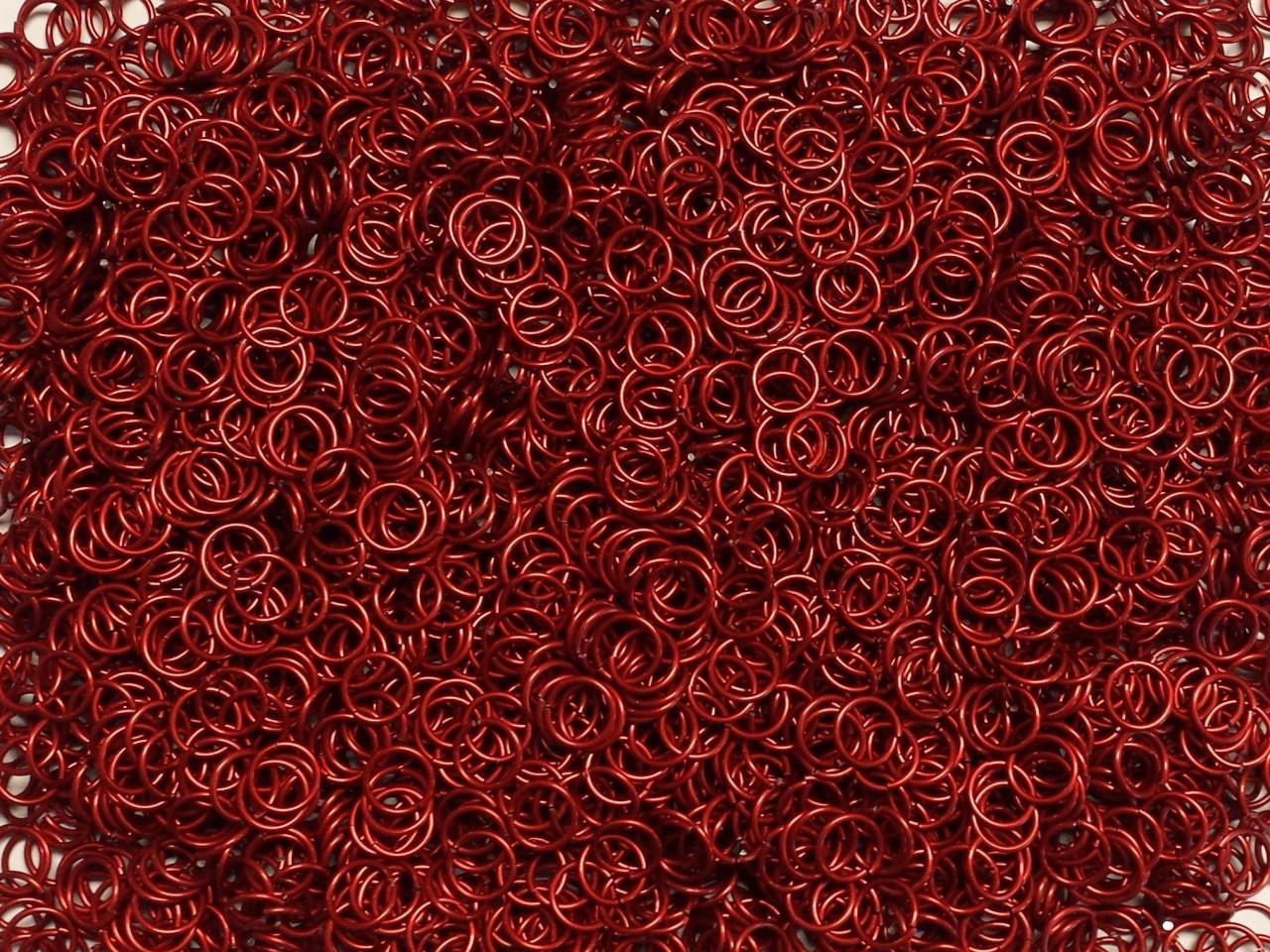 Red Anodized Aluminum jump rings in 18 SWG, 5/16 inch ID, 1/2 lb (8 oz)