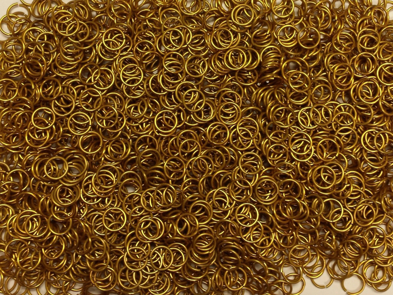 Gold Anodized Aluminum jump rings in 18 SWG, 5/16 inch ID, 1/2 lb (8 oz)