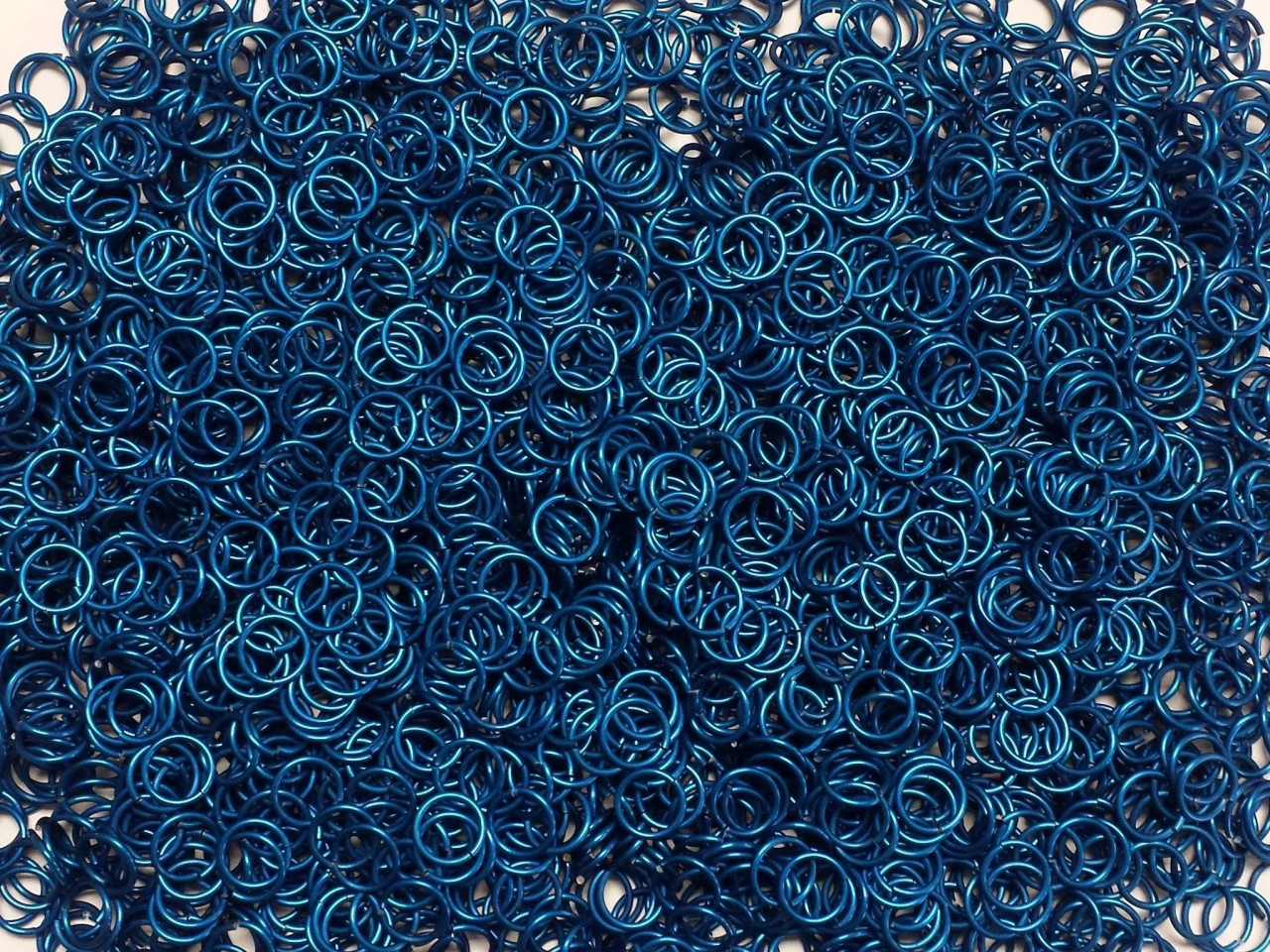 Blue Anodized Aluminum jump rings in 18 SWG, 5/16 inch ID, 1/2 lb (8 oz)