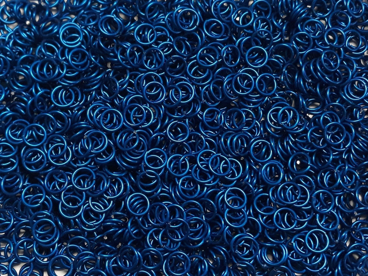 Blue Anodized Aluminum jump rings in 16 SWG, 5/16 inch ID, 1/2 lb (8 oz)