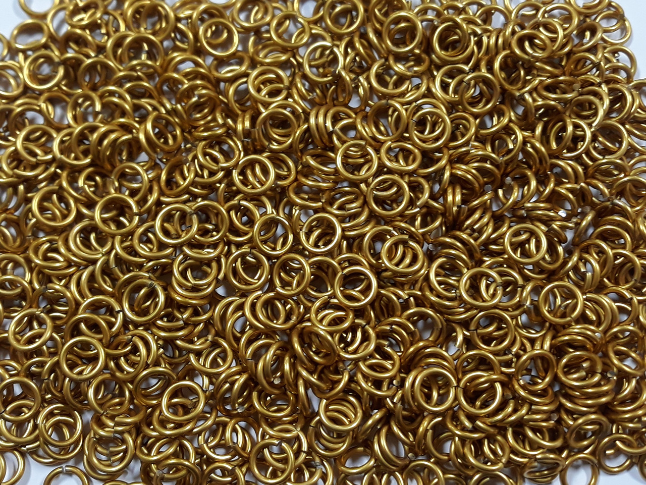 Gold Anodized Aluminum jump rings in 14 SWG, 5/16 inch ID, 1/2 lb (8 oz)