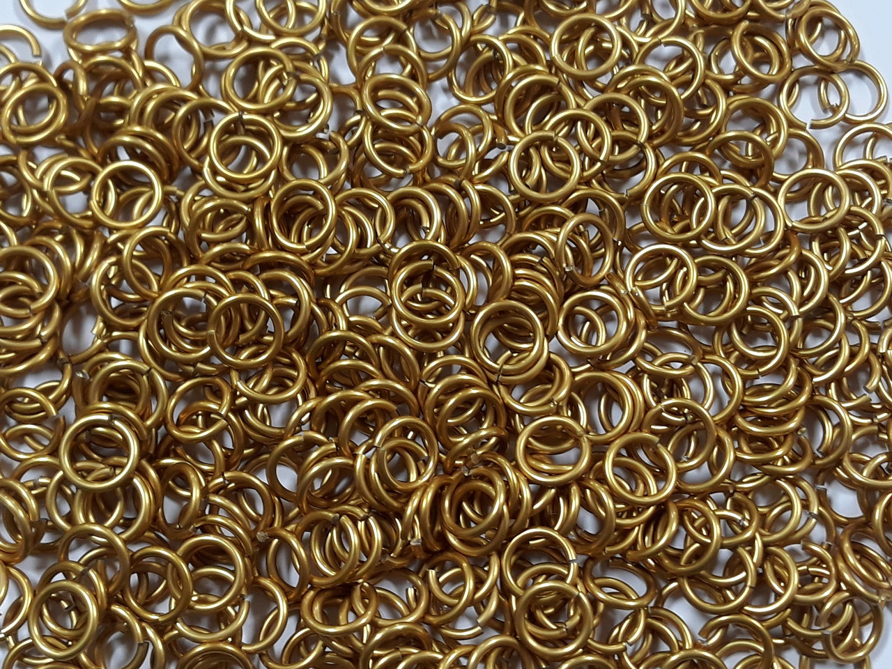 Gold Anodized Aluminum jump rings in 14 SWG, 3/8 inch ID, 1/2 lb (8 oz)