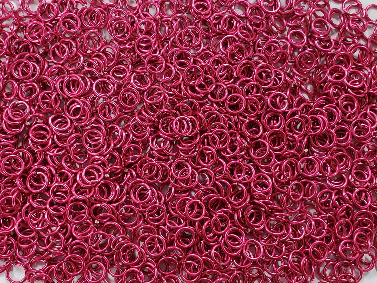 Cosmic Pink Anodized Aluminum jump rings in 16 SWG, 9/32 inch ID, 1 oz