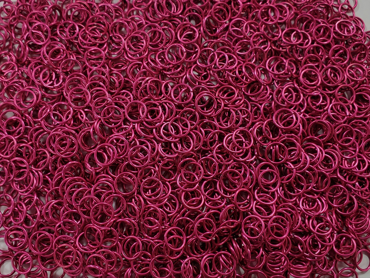 Cosmic Pink Anodized Aluminum jump rings in 18 SWG, 5/16 inch ID, 1 oz