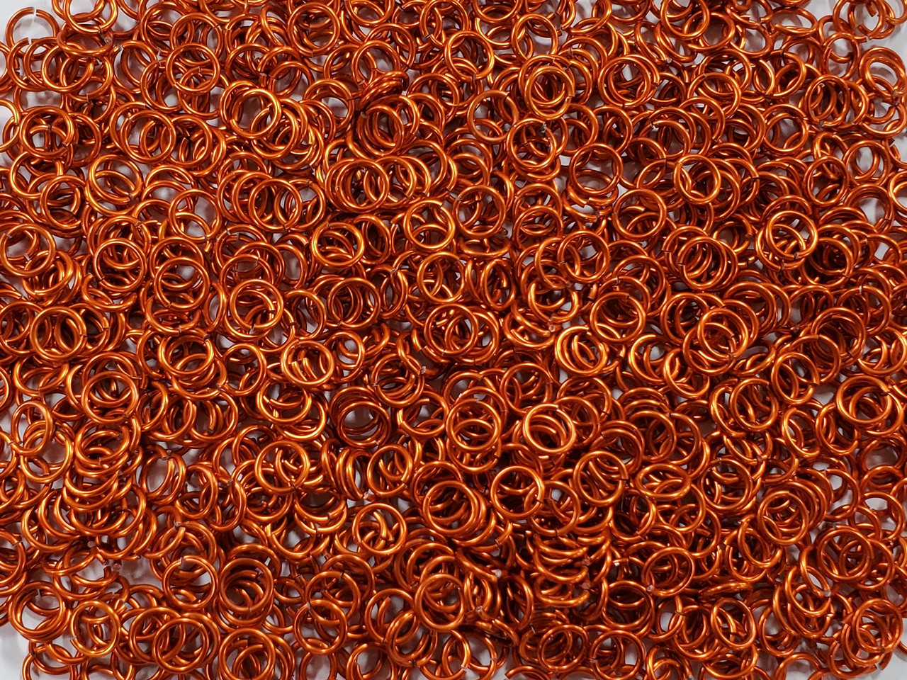 Orange Anodized Aluminum jump rings in 16 SWG, 5/16 inch ID, 1 oz