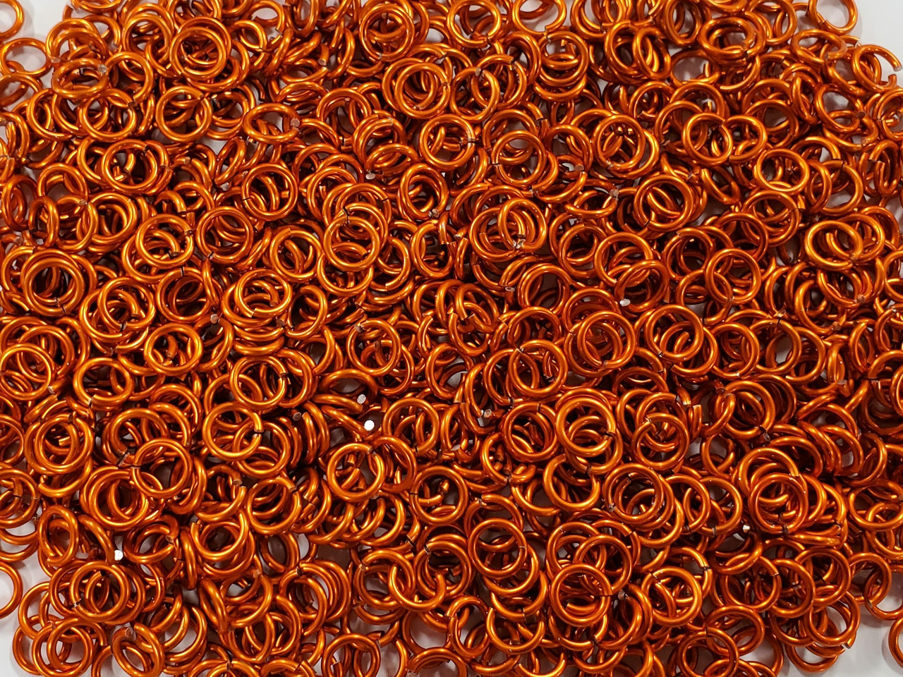 Orange Anodized Aluminum jump rings in 14 SWG, 5/16 inch ID, 1 oz