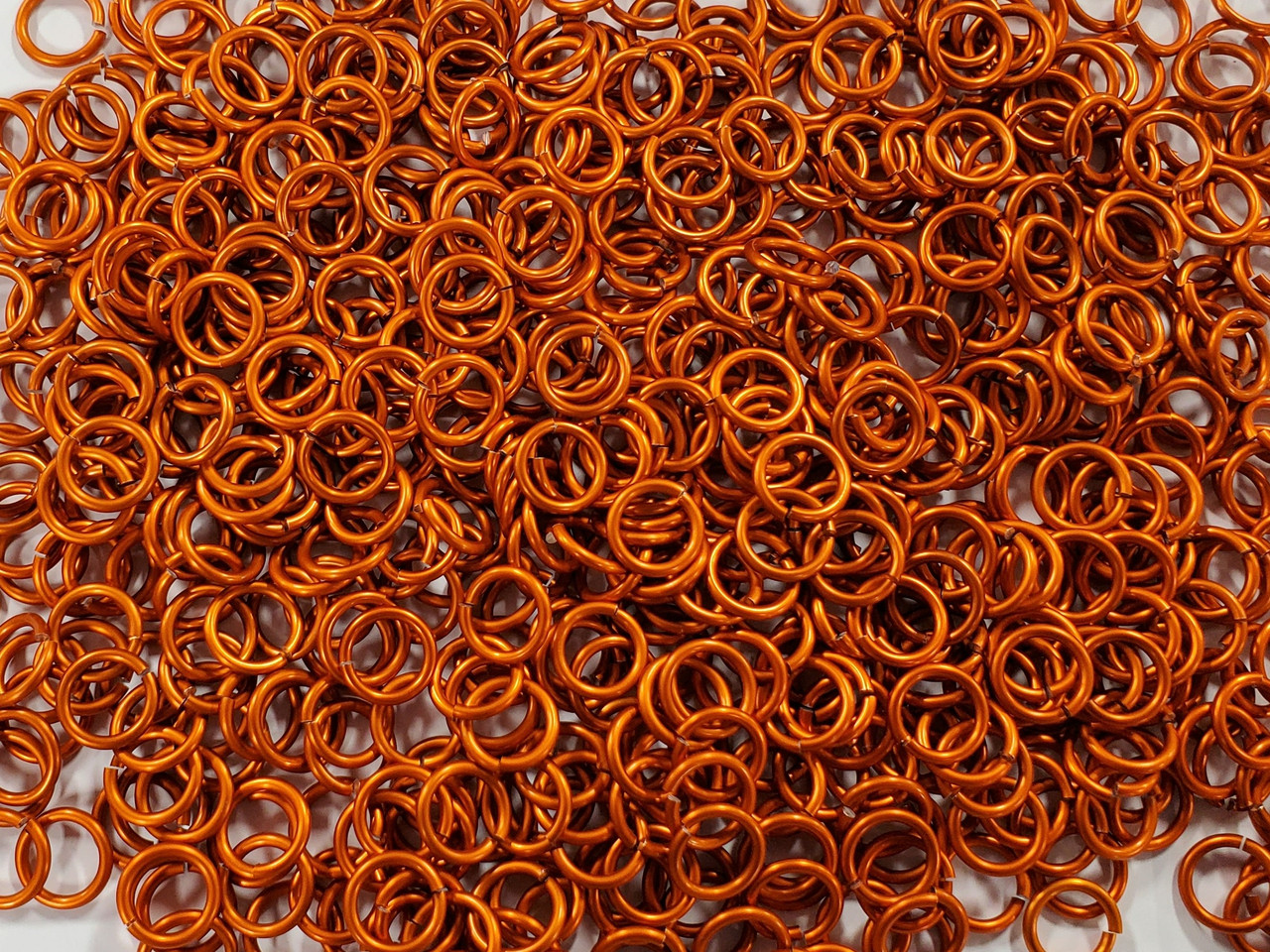 Orange Anodized Aluminum jump rings in 14 SWG, 3/8 inch ID, 1 oz