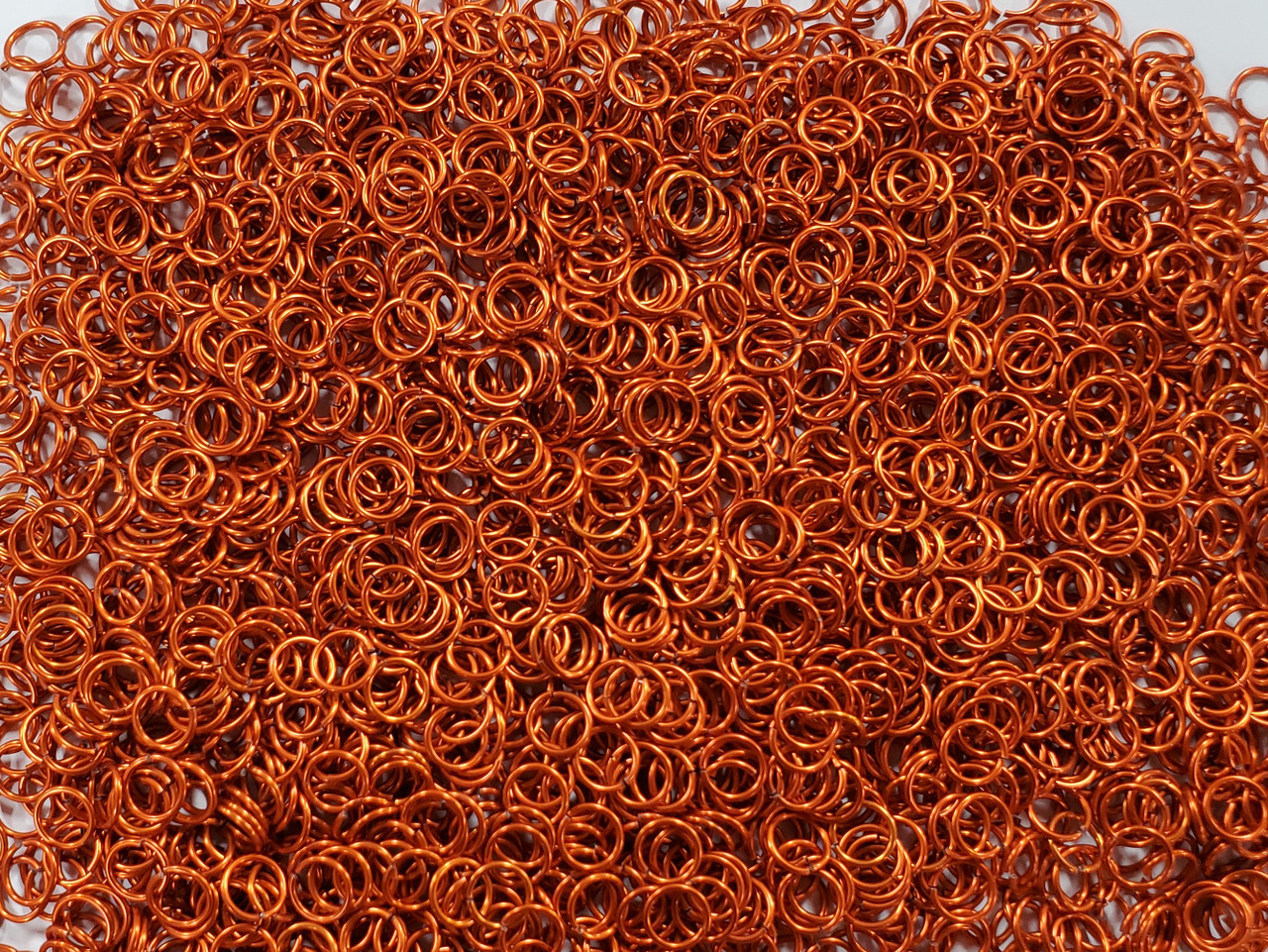 Orange Anodized Aluminum jump rings in 18 SWG, 9/32 inch ID, 1 oz