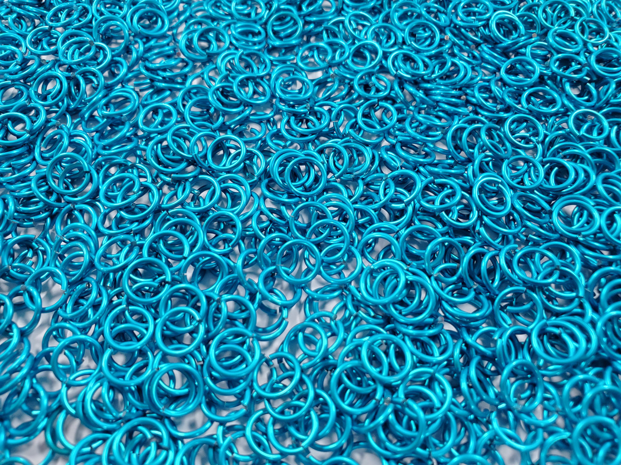 Turquoise Anodized Aluminum jump rings in 18 SWG, 1/4 inch ID, 1 oz