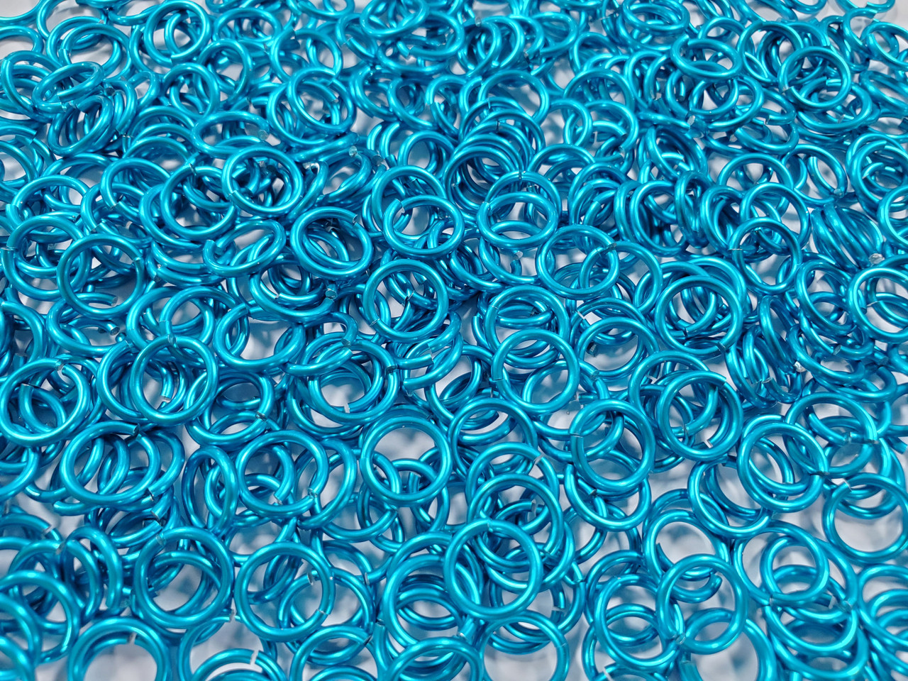Turquoise Anodized Aluminum jump rings in 16 SWG, 5/16 inch ID, 1 oz