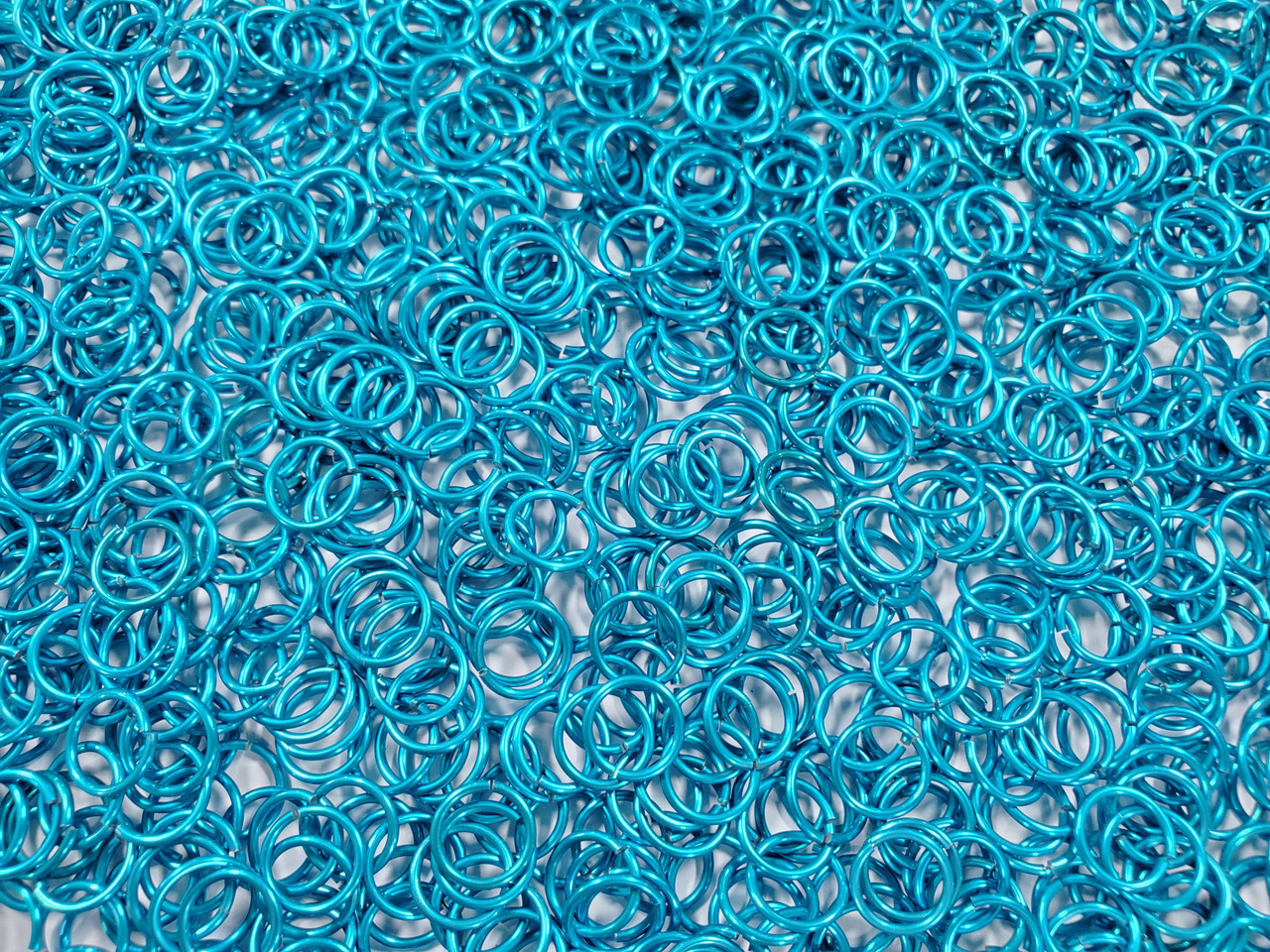 Turquoise Anodized Aluminum jump rings in 18 SWG, 5/16 inch ID, 1 oz