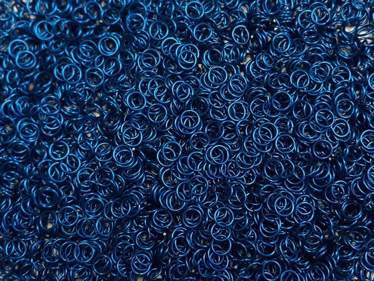 Blue Anodized Aluminum jump rings in 18 SWG, 9/32 inch ID, 1 oz