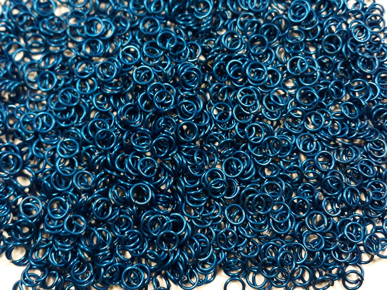Blue Anodized Aluminum jump rings in 16 SWG, 9/32 inch ID, 1 oz