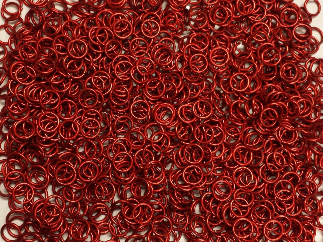 Red Anodized Aluminum jump rings in 16 SWG, 5/16 inch ID, 1 oz