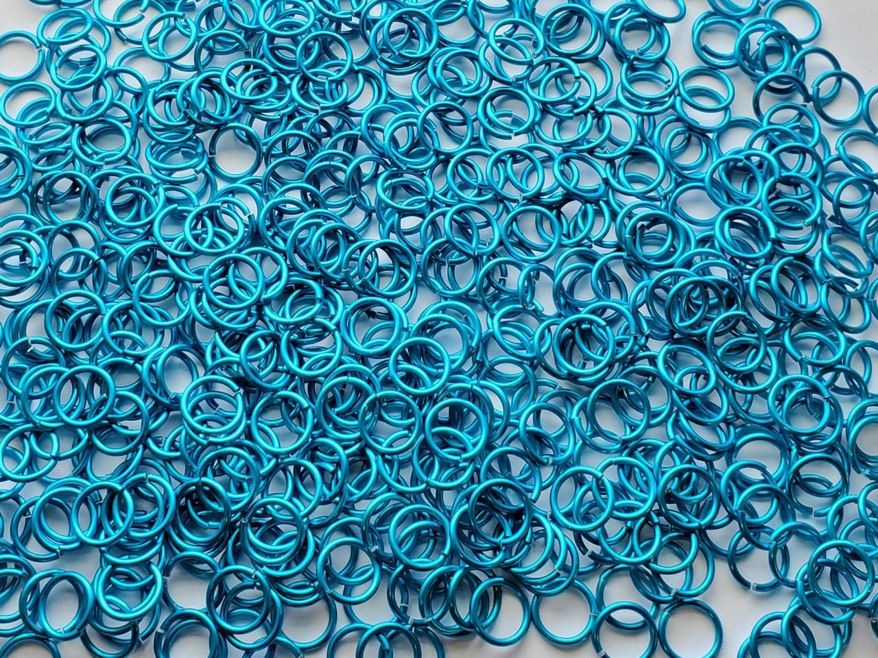 Turquoise Anodized Aluminum jump rings in 16 SWG, 3/8 inch ID, 1/2 lb (8 oz)