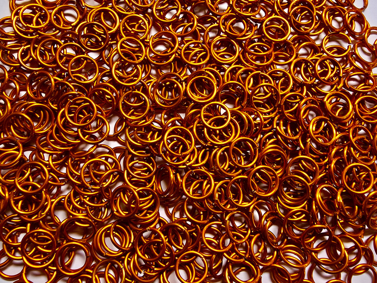 Orange Anodized Aluminum jump rings in 16 SWG, 3/8 inch ID, 1 oz